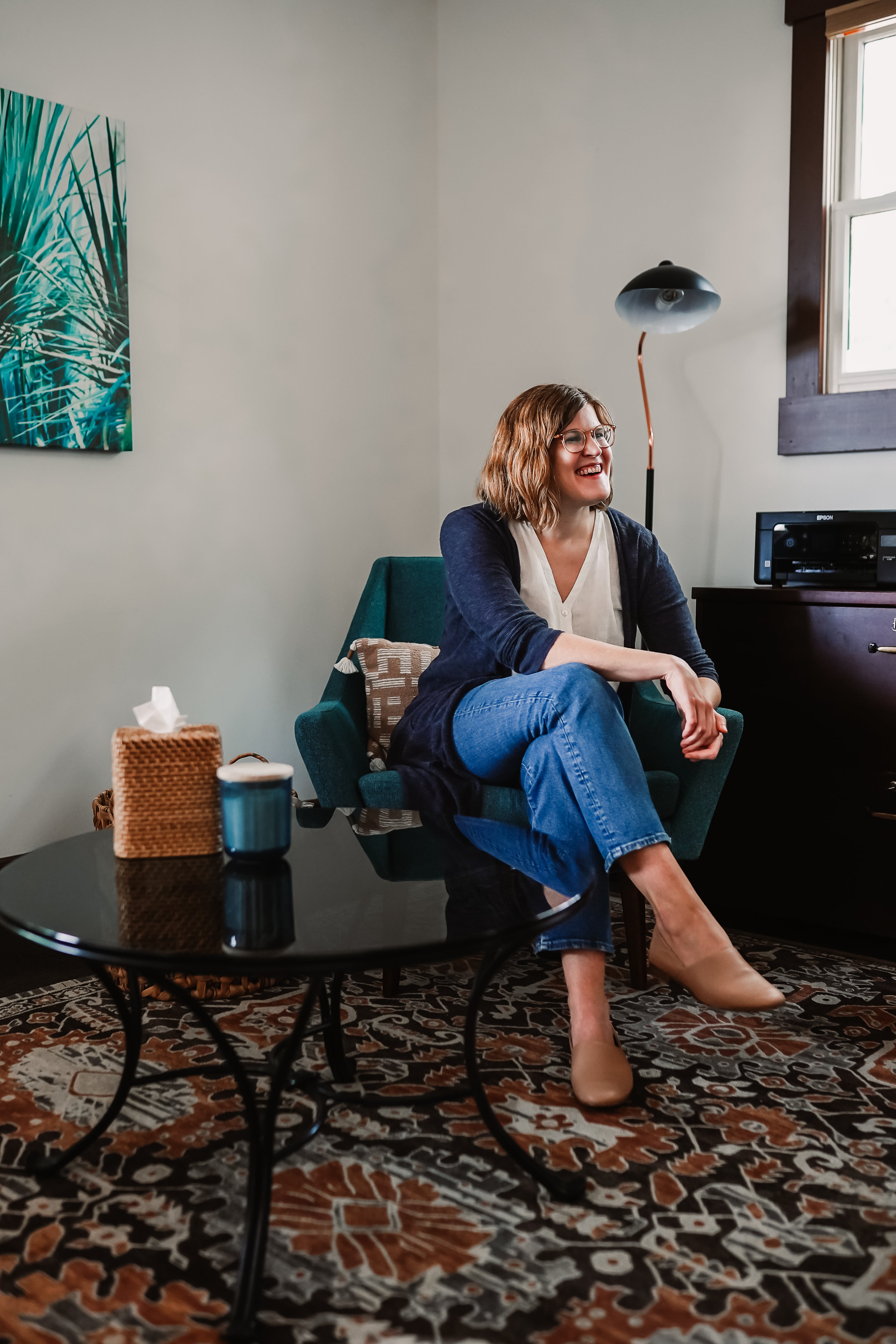 Dr Ruth Viehoff, psychologist, is seated and talking with a client in her Indianapolis therapy office.