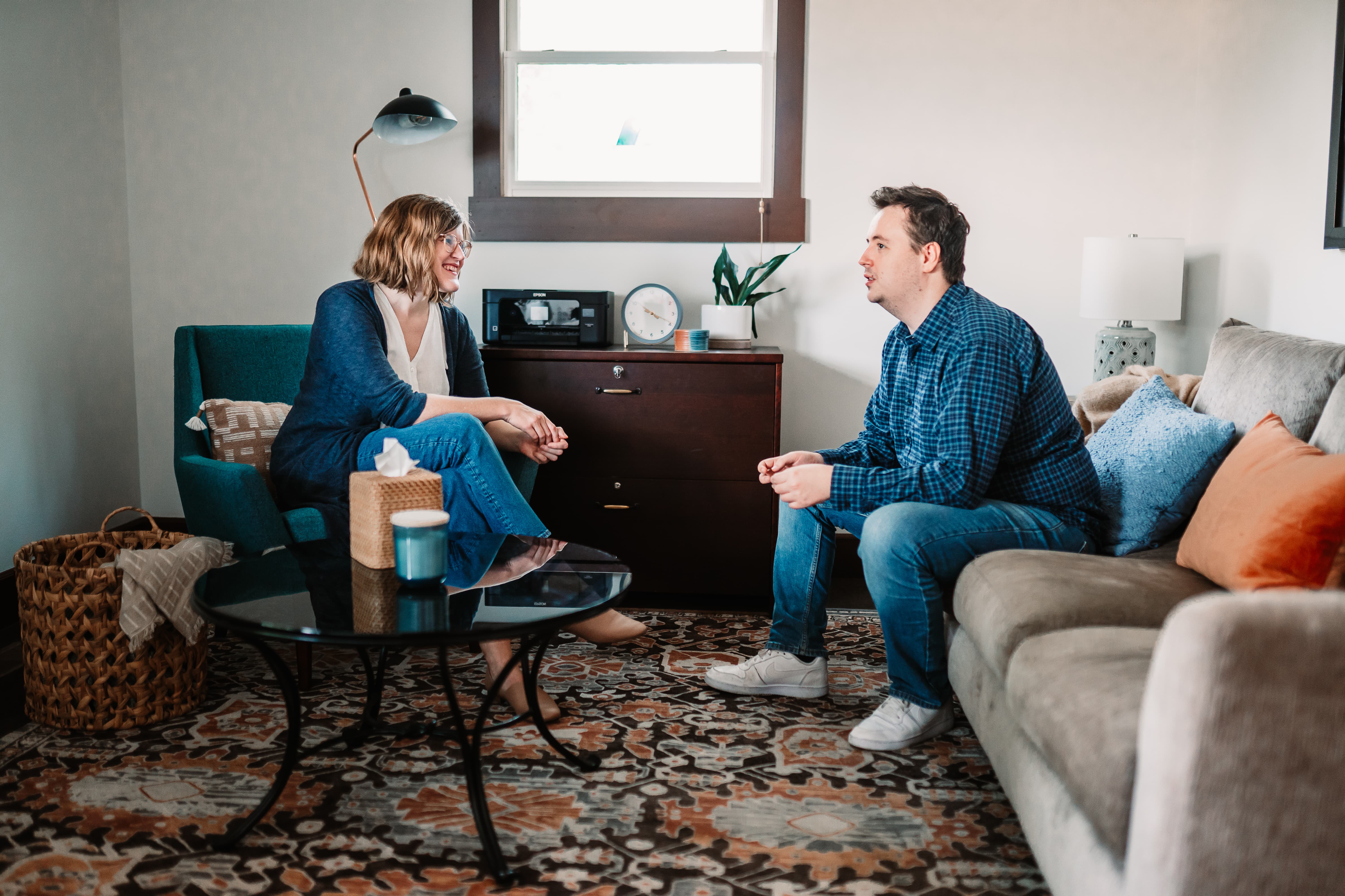 Include alt text: Dr. Ruth Viehoff, Indianapolis clinical psychologist, is in a therapy session with a male client.